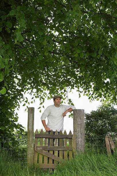 istock Thoughtful Man Standing Across Field Gate 531023395