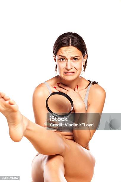 Disgusted Girl Looking At Hair On Her Legs Stock Photo - Download Image Now - 2015, Adult, Adults Only