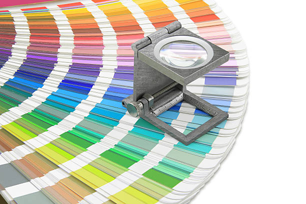 istock Magnifying glass standing on swatches pallete 531026119