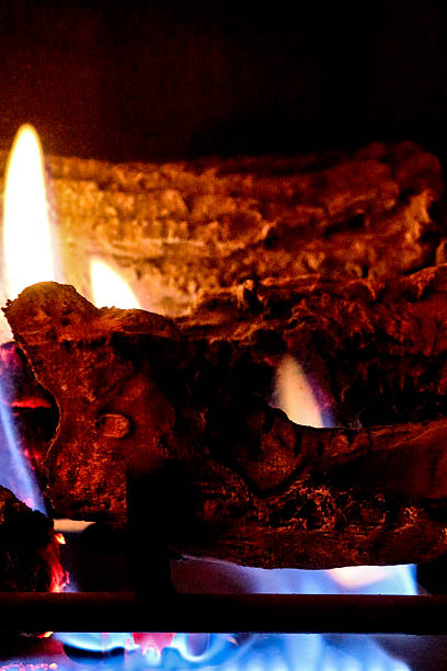 istock Gas fireplace flame and synthetic logs with vertical composition 531034489