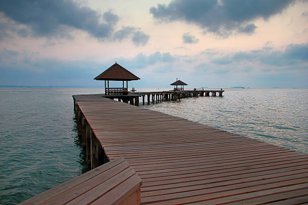 istock wooden bridge in the port between sunrise sky 531034645