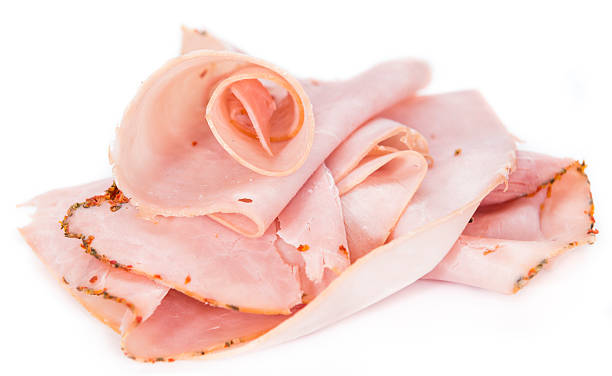 Ham isolated on white Portion of Ham isolated on pure white background cold cuts meat photos stock pictures, royalty-free photos & images