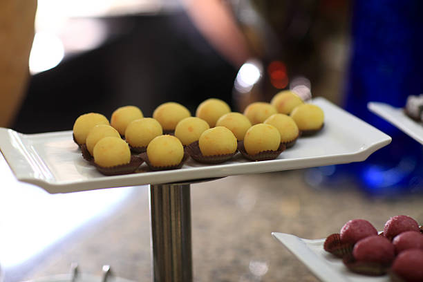 istock Tray with yellow ball cakes canape 531034913
