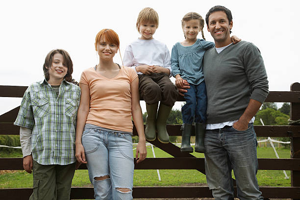 istock Family Against Fence In Field 531036049