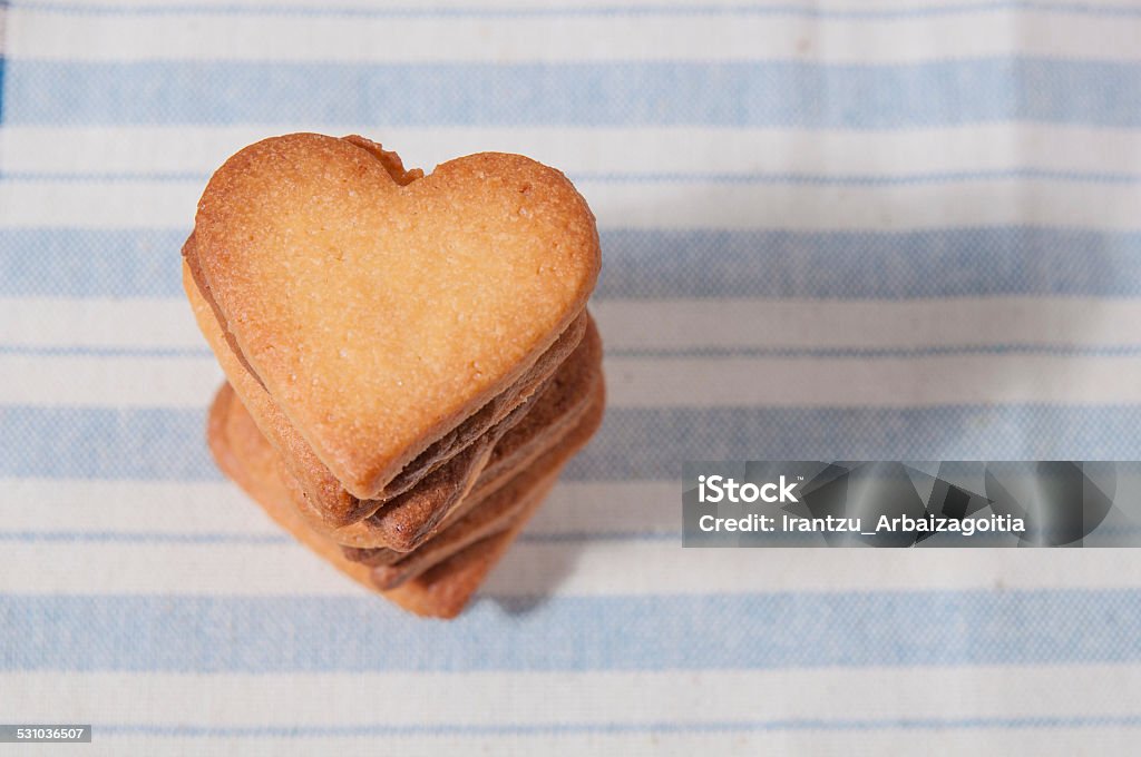 Butter cookies, heart shaped, on a striped fabric napkin 2015 Stock Photo