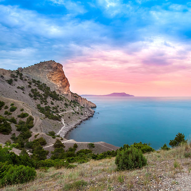 istock Beautiful sunset above the sea and mountain 531037579