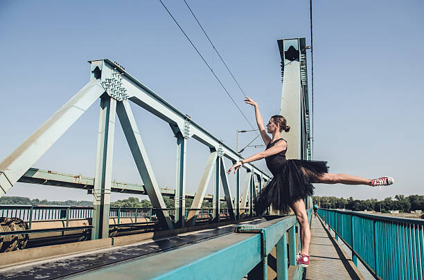 istock Ballerina posing on metal bridge 531037983