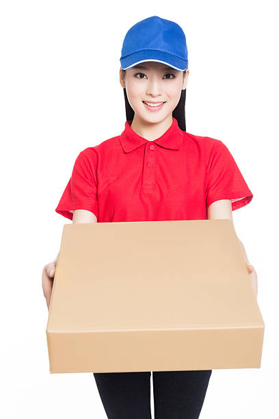 istock delivery woman carrying cardboard box 531038239