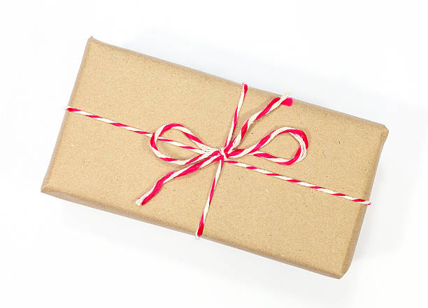 istock brown paper parcel tied with red and white string 531038283