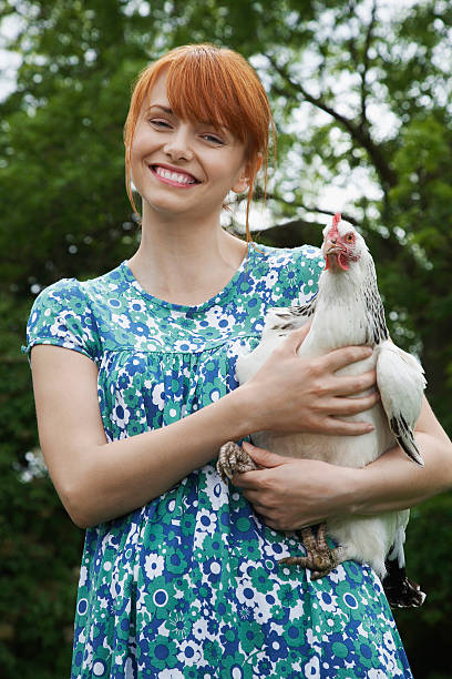 istock Cheerful Young Woman Carrying Hen 531038597