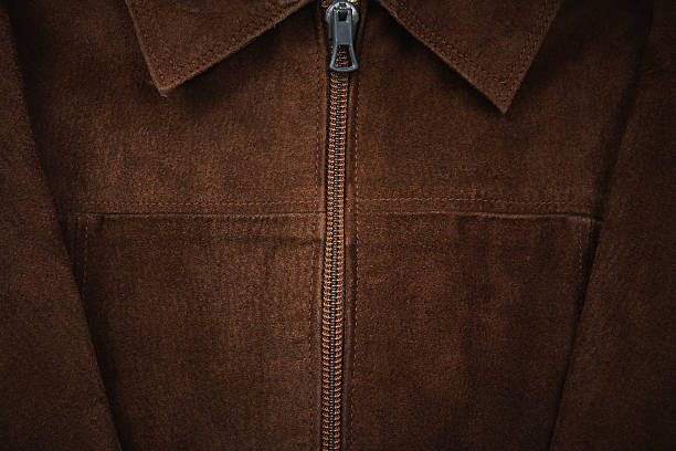 Brown suede jacket Brown suede jacket in the background leather pocket clothing hide stock pictures, royalty-free photos & images