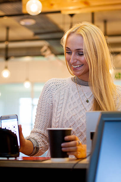 istock Paying for my coffee is so easy - contactless payment 531042984