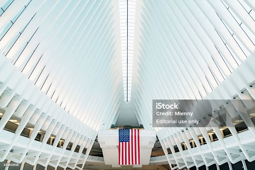 Oculus New York City WTC Transportation Hub New York City, USA - May 7, 2016: American Flag inside the main hall of the new Oculus, the  World Trade Center Transportation Hub: The World Trade Center Transportation Hub is the Port Authority of New York and New Jersey's name for the new PATH.  Lower Manhattan, New York City, USA. Grand Central Station - Manhattan Stock Photo