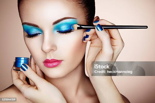 Makeup Artist Applies Eye Shadow Stock Photo - Download Image Now - Cool Attitude, Make-Up Artist, 2015