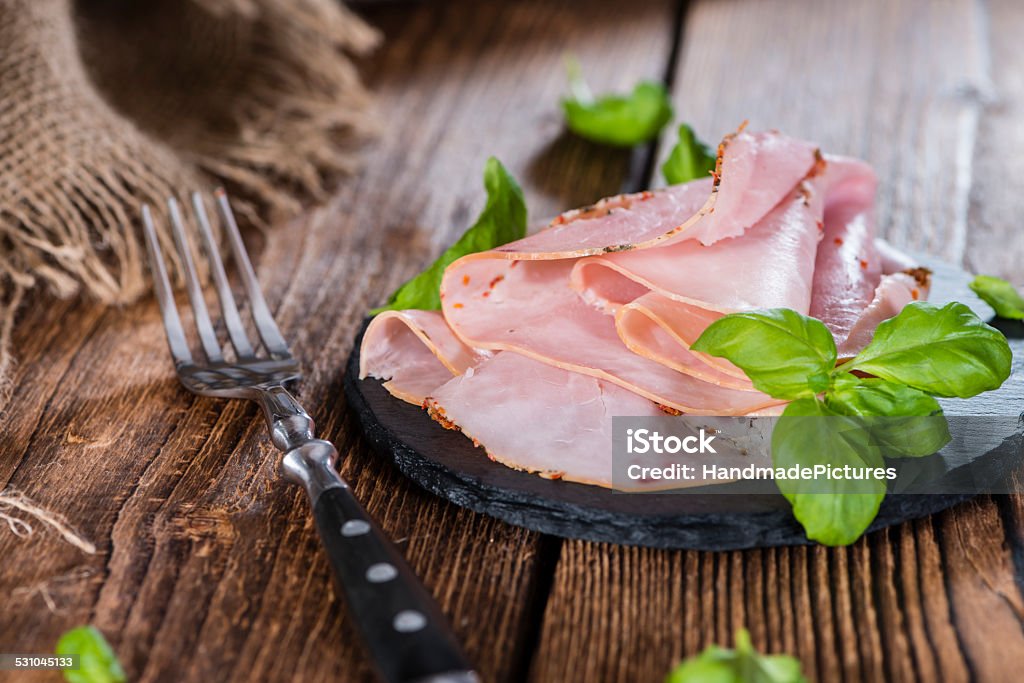 Ham Portion of Ham with fresh herbs (close-up shot) 2015 Stock Photo