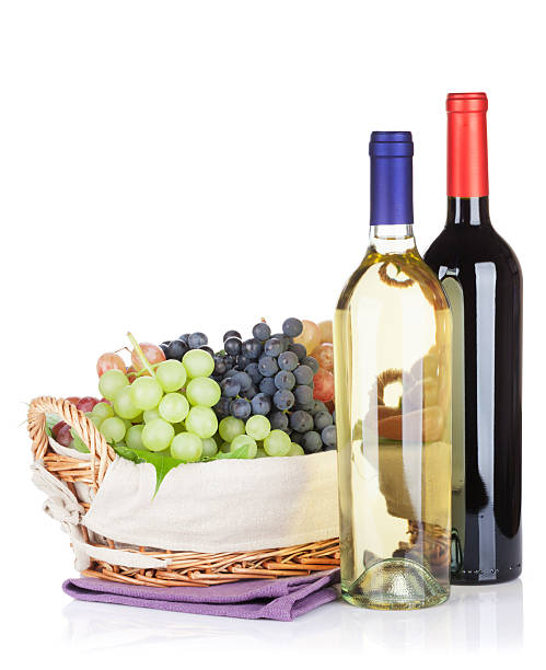 istock White and red wine bottles and grapes 531045294