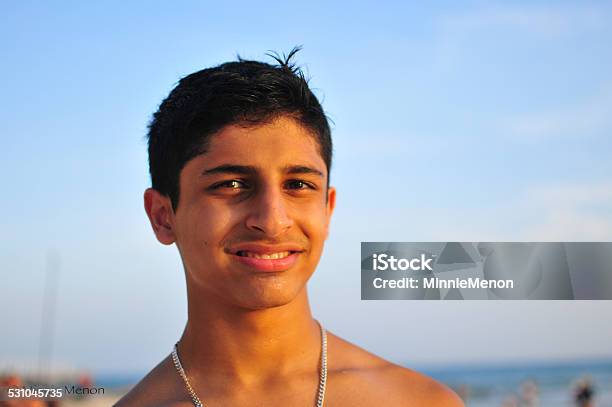 Young Indian Man At The Beach Stock Photo - Download Image Now - 16-17 Years, 2015, Adolescence