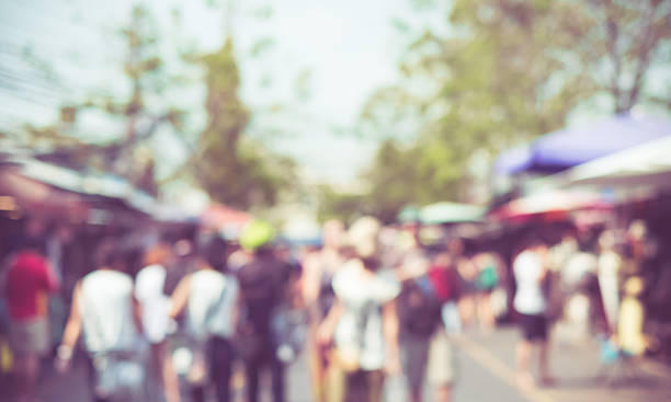 istock Blurred background people shopping at fair in sunny day 531045998