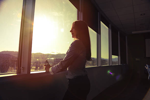 istock CEO woman looking out board room 531046768