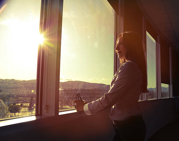 istock CEO woman looking out board room 531046788