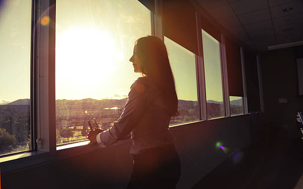 istock CEO woman looking out board room 531046866