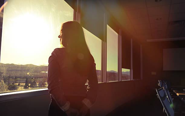 istock CEO woman looking out board room 531046898
