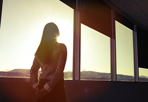 istock CEO woman looking out board room 531046938