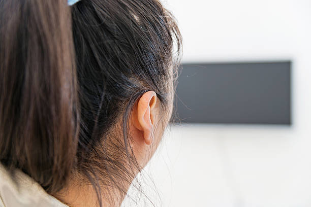 istock asian woman watching TV 531047225