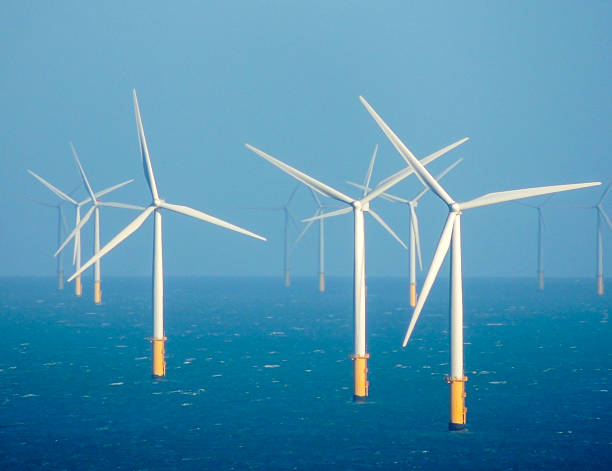 Clean sustainable energy - wind turbines in the sea Wind turbines in the Irish Sea. Photo taken near Llandudno, Wales. gwynedd photos stock pictures, royalty-free photos & images