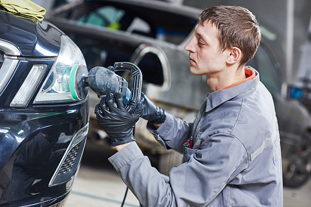 istock auto mechanic buffing and polishing car headlight 531048376