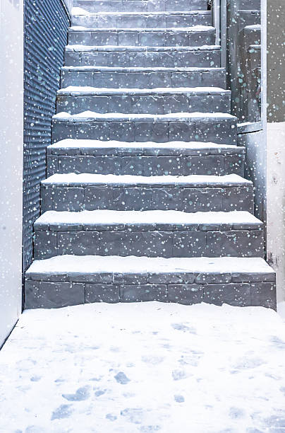 istock Old stall close texture round stair with snow 531048505