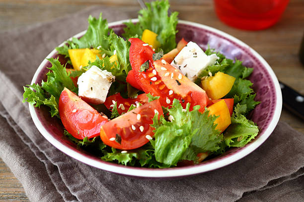 istock Salad with tomatoes, cheese and greens 531049231
