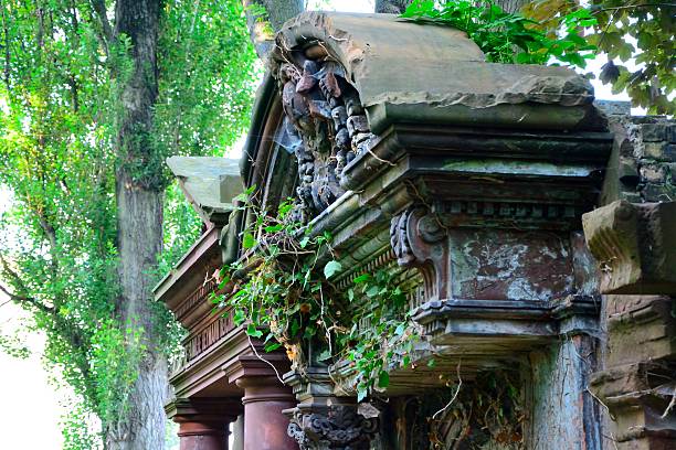 London, USA - Aug 3, 2017: Grave stone at the historic Highgate cemetery in London late in the day.