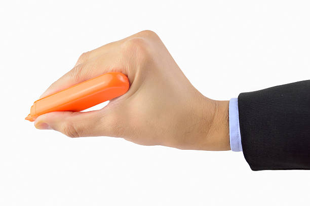 businessman using an orange marker hand businessman using an orange marker with white background man writing on white board stock pictures, royalty-free photos & images