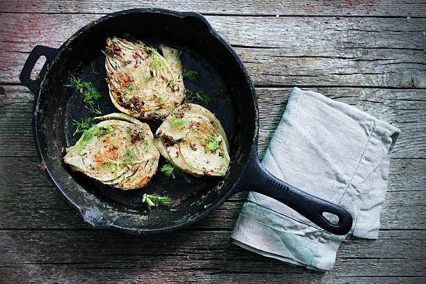 Fennel baked in milk, with spices, rustic, italian recipe