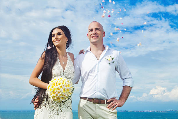 istock Cheerful bride and groom against sea view 531057799