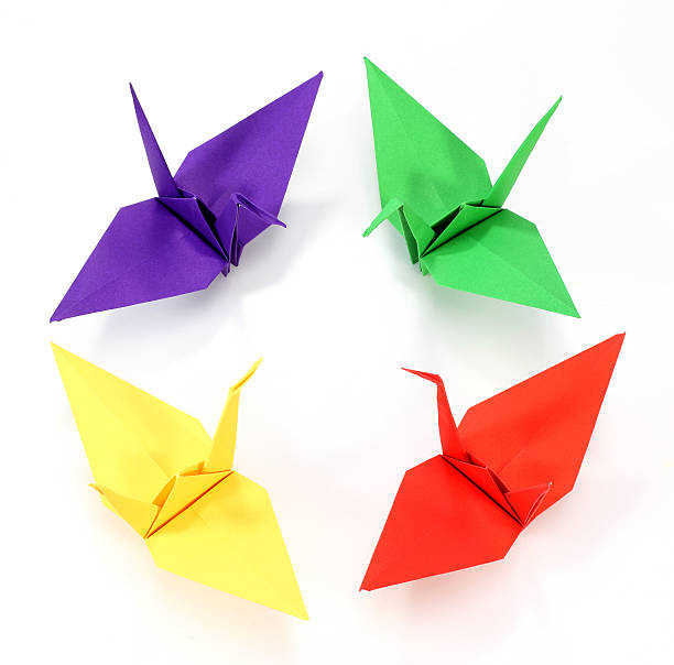 istock colorful Origami cranes on white background 531058181