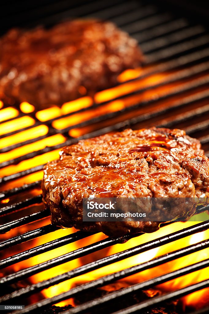 Barbecue Burgers Close up photograph of two grilled beef burgers 2015 Stock Photo