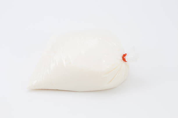 istock Milk in plastic bag on white background 531058291