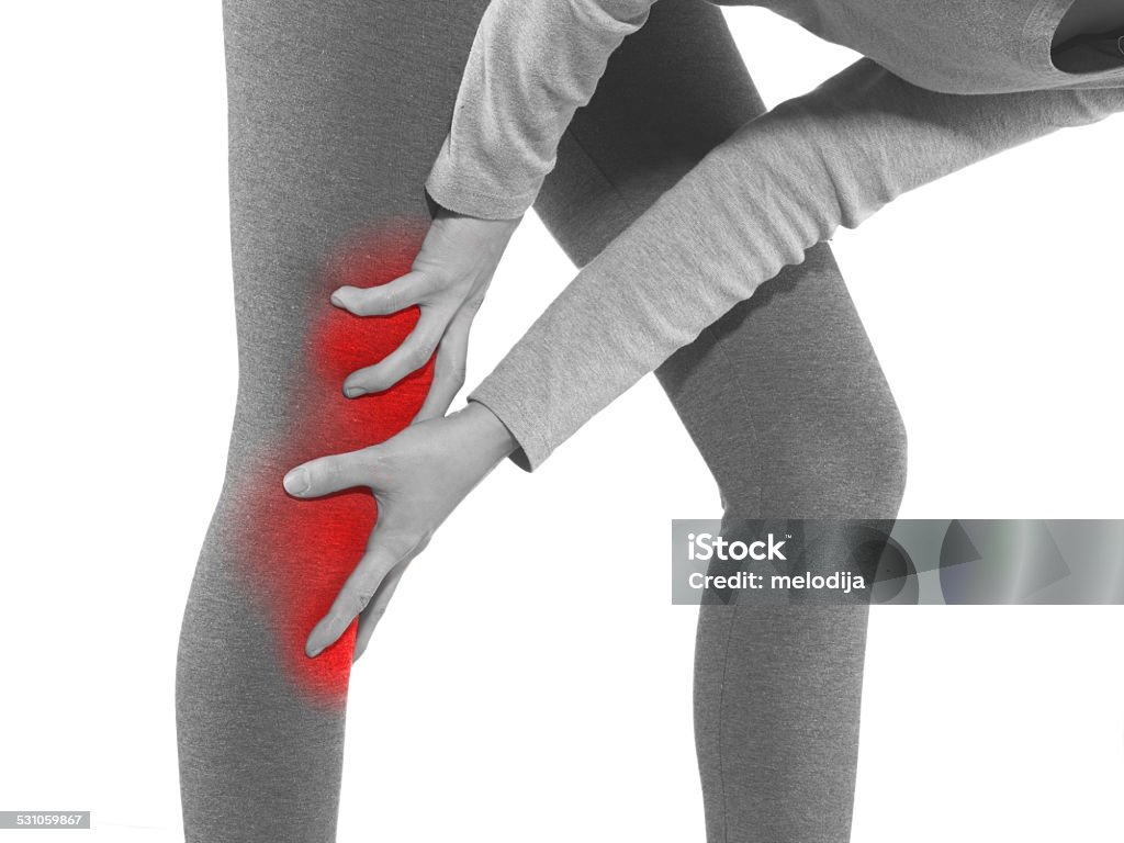 Human knee pain joint problem medical health care concept. Human knee pain with an anatomy injury caused by sports accident or arthritis as a skeletal joint problem medical health care concept. Acute Angle Stock Photo