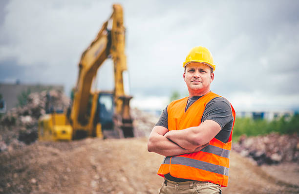 Earth Digger Driver at construction site Earth Digger Driver at construction site bulldozer photos stock pictures, royalty-free photos & images