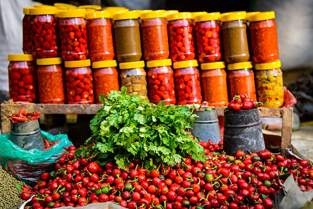 Coriander, chillis and jars on a market in Nepal