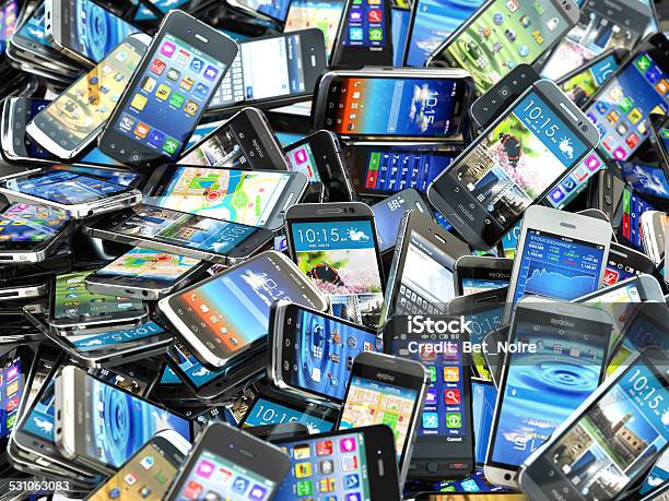 Mobile Phones Background Pile Of Different Modern Smartphones Stock Photo - Download Image Now