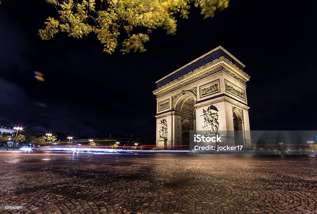 Arc de triomphe by night with trafic lights 2015 Stock Photo