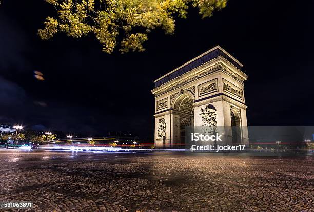 Arc De Triomphe By Night With Trafic Lights Stock Photo - Download Image Now - 2015, Arc de Triomphe - Paris, Arch - Architectural Feature