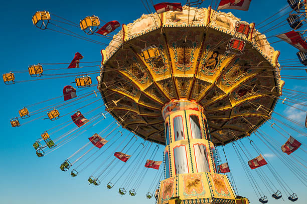 carousel spinning - carnival amusement park swing traditional festival стоковые фото и изображения