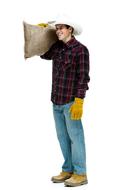 istock Cheerful male farmer holding burlap sack 531065029