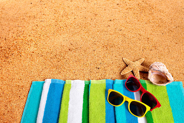 istock Tropical summer beach background, sunglasses, couple sunbathing, 531065912