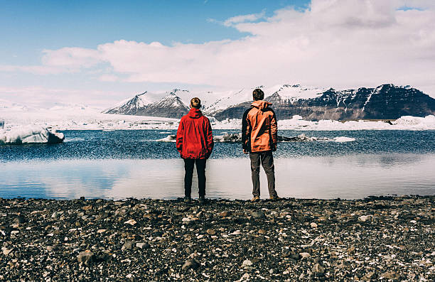 istock Two men standing near the lake with glaciers 531068248