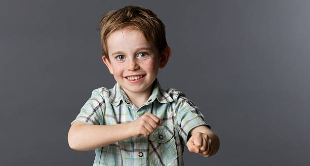 istock dynamic young child playing with his fists for fun game 531068768